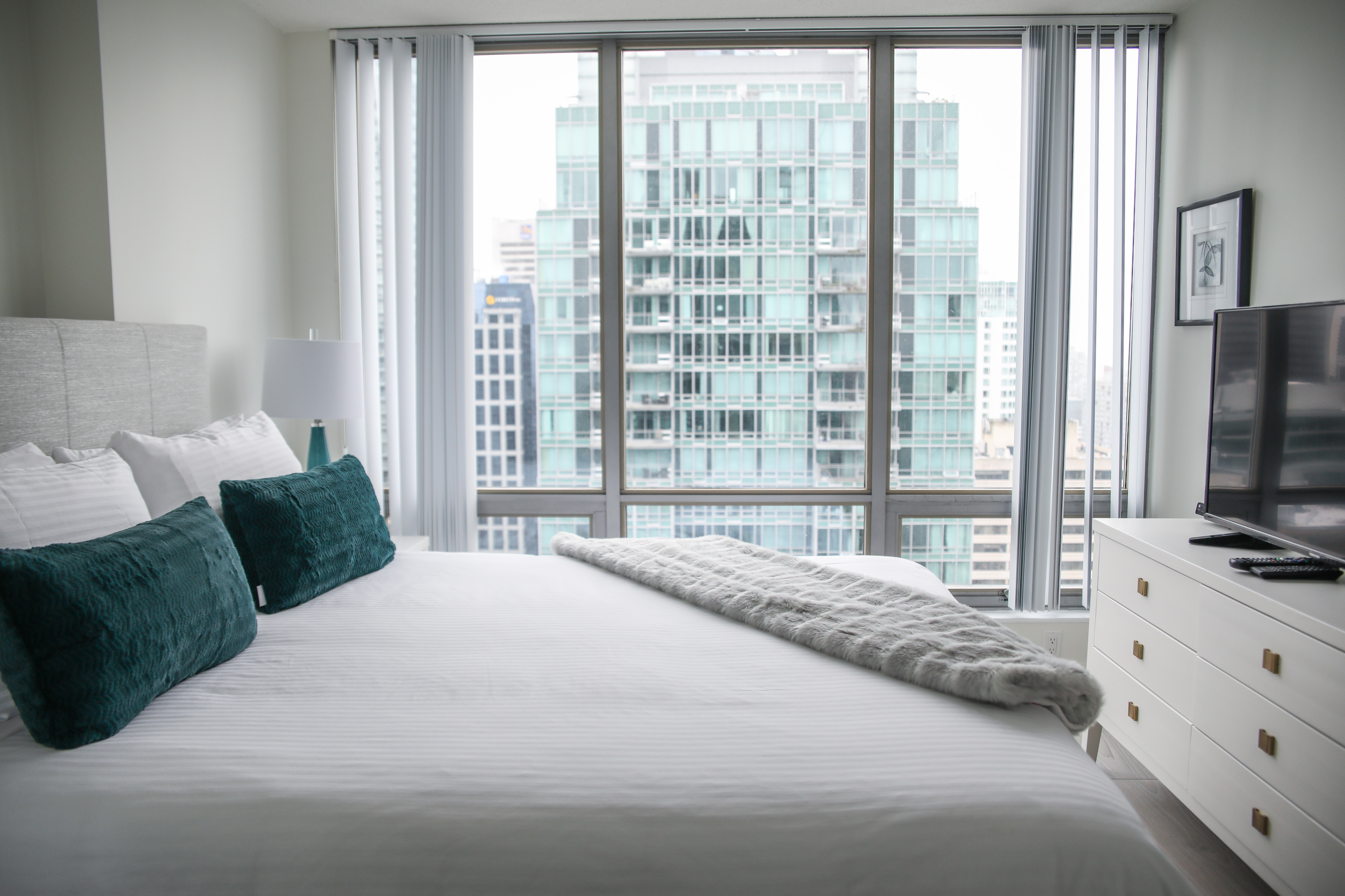 clean white and bright bed at Vancouver Extended Stay